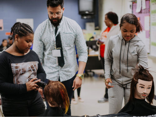 On the Road youth engage in a Career Enrichment course for hair stylists