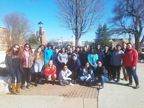 Group of students visiting a college campus.
