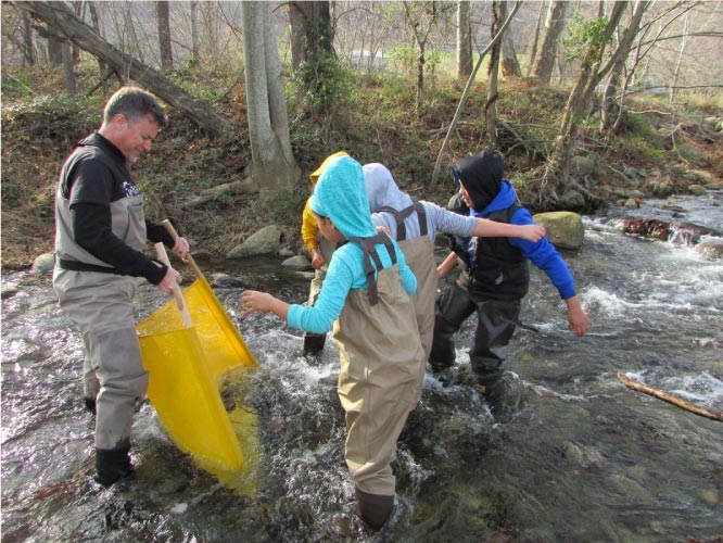 Science teacher Jeff Peake takes On the Road Youth fishing to learn about the environment
